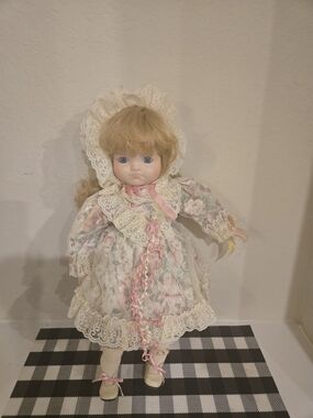 Vintage-Inspired Porcelain Baby Doll in Cream and Pink Dress